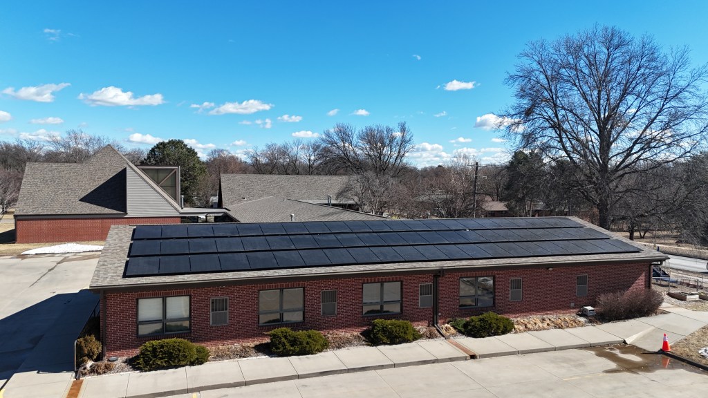 West view of South Gate United Methodist Church from low drone angle showing solar panel installation